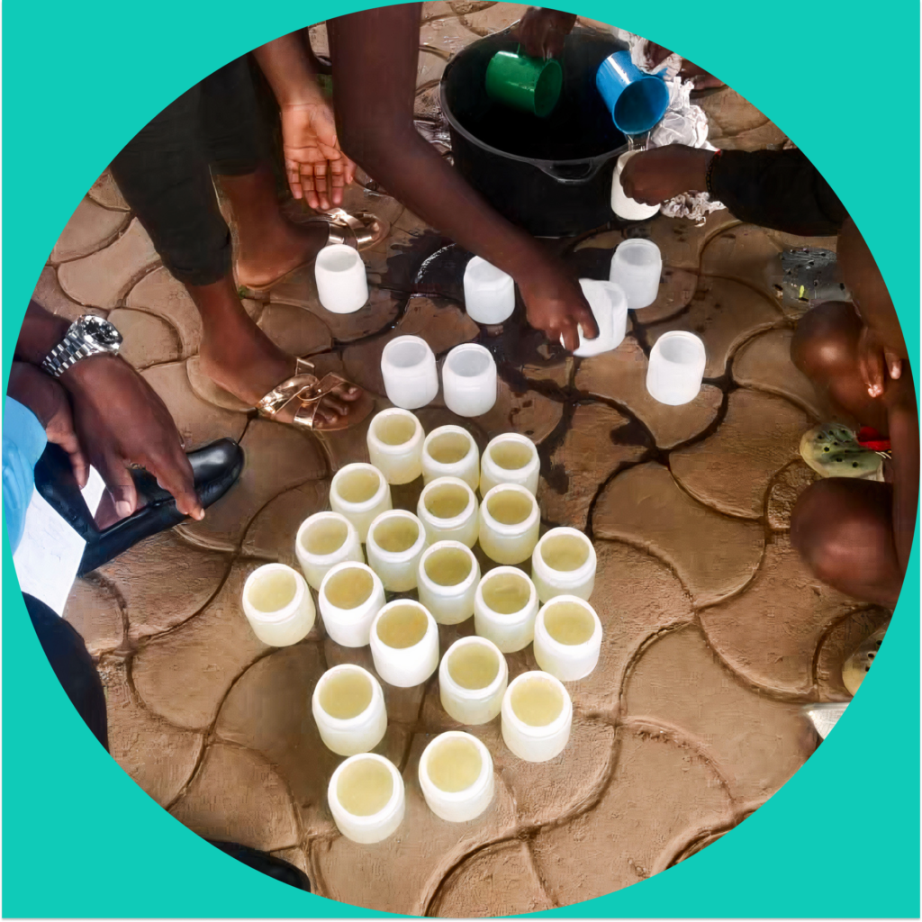 Learning circle participants pour petroleum jelly into molds